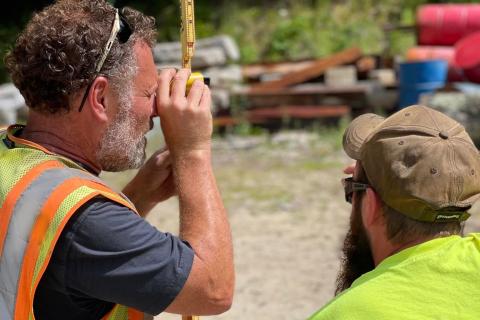 Surveying in dirt lot